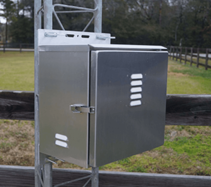 Tower-mounted solar battery cabinet