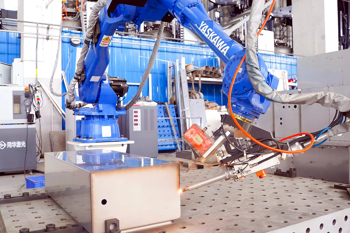 Robot welding machine operating on an electrical enclosure