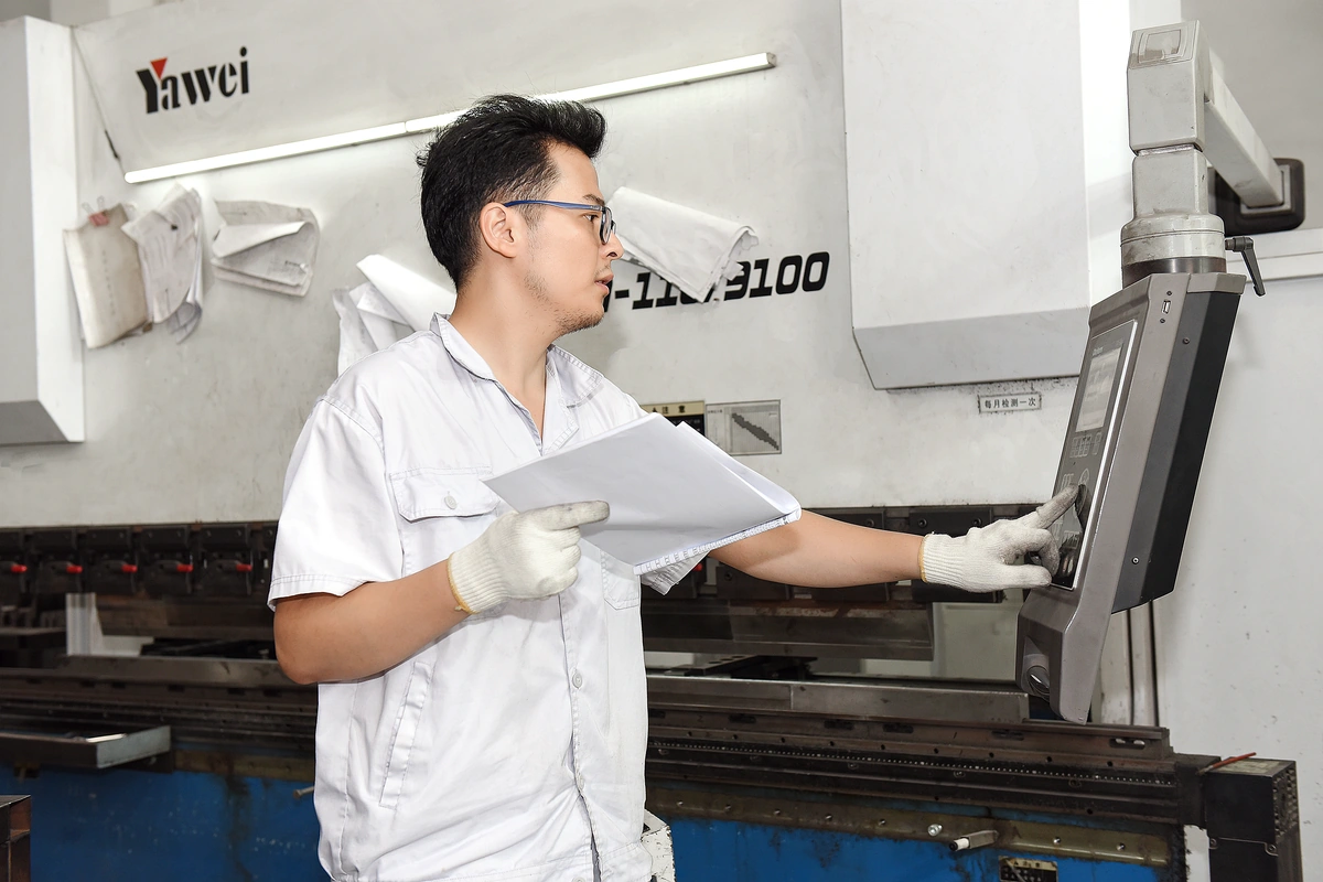 KDM enclosure manufacturing workplace scene 2