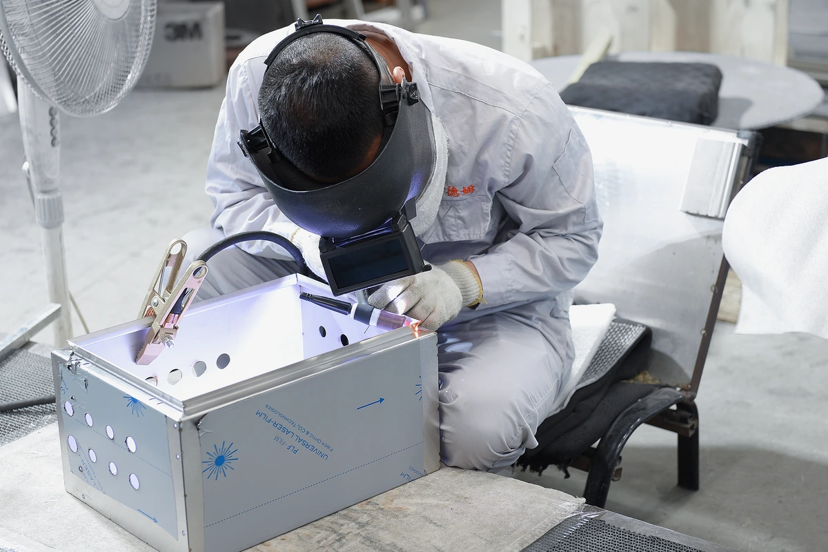 KDM enclosure manufacturing workplace scene 3